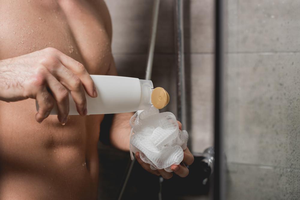 dispensing soap into loofah