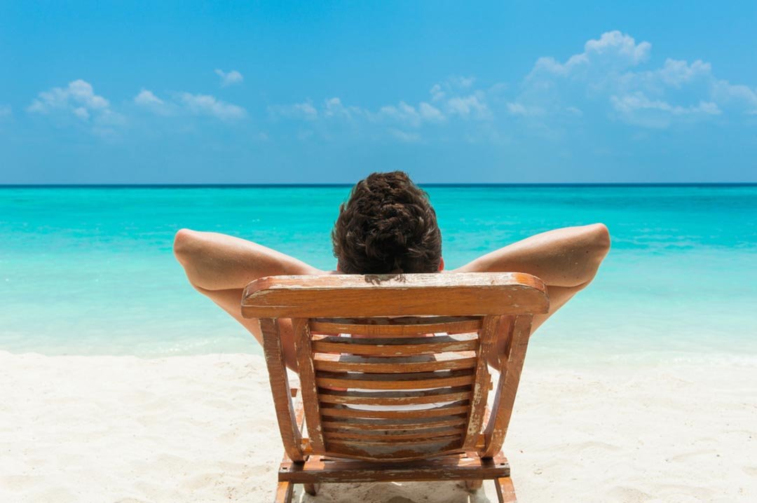 man relaxing on beach