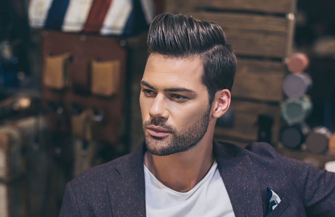portrait man sitting in barber shop